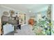 Home office with built-in desk, French doors, and a ceiling fan at 104 Buckeye Ln, Chapel Hill, NC 27516