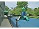 Safe playground with slides and climbing structures, surrounded by trees and a secure fence at 104 Buckeye Ln, Chapel Hill, NC 27516