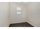 This vacant bedroom offers a window for natural light and dark, hardwood floors at 104 Lowe Wood Ct, Durham, NC 27703