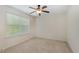 Light-filled bedroom featuring one window, neutral walls, and plush carpet at 104 Lowe Wood Ct, Durham, NC 27703