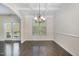 Dining room features a coffered ceiling and dark wood floors at 104 Lowe Wood Ct, Durham, NC 27703