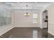 Elegant dining room featuring a coffered ceiling and a chandelier at 104 Lowe Wood Ct, Durham, NC 27703