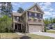 Charming two-story home with a two-car garage and beautifully landscaped front yard at 104 Lowe Wood Ct, Durham, NC 27703