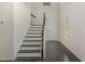 Bright foyer with hardwood floors, staircase, and white trim creating a welcoming entrance at 104 Lowe Wood Ct, Durham, NC 27703