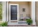 Cozy front porch with seating and charming decor, inviting you to relax and enjoy the outdoors at 104 Lowe Wood Ct, Durham, NC 27703