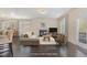 Bright living room features a fireplace, large windows, and modern decor at 104 Lowe Wood Ct, Durham, NC 27703
