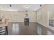 Bright living room featuring a fireplace, hardwood floors, and large windows for natural light at 104 Lowe Wood Ct, Durham, NC 27703