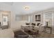 Virtual staged Gathering room with stairs, comfortable seating, and natural light at 104 Lowe Wood Ct, Durham, NC 27703