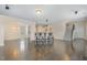 Open concept living space with hardwood floors and seamless flow between dining and living areas at 104 Lowe Wood Ct, Durham, NC 27703