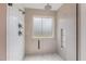Shower features detailed tile, glass door, two shower heads and built in shelving at 104 Lowe Wood Ct, Durham, NC 27703