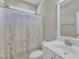 Bathroom featuring single sink vanity, toilet, and shower with shower curtain at 1077 Williams-White Rd, Zebulon, NC 27597