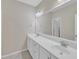 Bathroom featuring dual sinks and modern lighting at 1077 Williams-White Rd, Zebulon, NC 27597