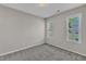 Bedroom with carpet flooring and two windows for ample natural light at 1077 Williams-White Rd, Zebulon, NC 27597