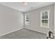 Bedroom with neutral carpeting, and two windows for ample natural light at 1077 Williams-White Rd, Zebulon, NC 27597