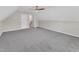 Large bonus room with access to a staircase and carpeted floor at 1077 Williams-White Rd, Zebulon, NC 27597