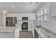 Bright, modern kitchen features granite counters, stainless appliances, white subway tile, and natural light at 1077 Williams-White Rd, Zebulon, NC 27597