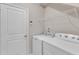 Laundry room featuring white washer, dryer, and shelving for storage at 1077 Williams-White Rd, Zebulon, NC 27597