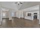 Open floor plan showcases hardwood floors, a kitchen island, and bright, neutral paint at 1077 Williams-White Rd, Zebulon, NC 27597