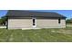 Exterior shot of the home's back showing siding and a concrete patio at 108 Pate Landing Dr, Selma, NC 27576