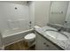 Clean bathroom features a shower-tub combo, white vanity with countertop, and ample lighting at 108 Pate Landing Dr, Selma, NC 27576