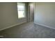 Comfortable bedroom with soft carpet, natural light, and view into closet offers relaxation at 108 Pate Landing Dr, Selma, NC 27576
