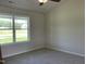 Cozy bedroom features plush carpet and a large window allowing for ample natural light at 108 Pate Landing Dr, Selma, NC 27576