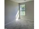 Bright bedroom featuring soft carpet and a large window for plenty of natural light at 108 Pate Landing Dr, Selma, NC 27576