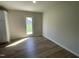 Bright dining area features wood-look floors and a glass door for access to the outdoors at 108 Pate Landing Dr, Selma, NC 27576