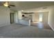 Open-concept living space features a modern kitchen with white cabinets and a spacious area perfect for entertaining at 108 Pate Landing Dr, Selma, NC 27576