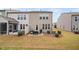 Spacious backyard featuring a patio area with comfortable seating and well-manicured lawn at 1103 Kudzu St, Durham, NC 27713