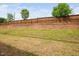 Expansive backyard featuring a wooden fence and terraced landscaping, offering privacy and space at 1103 Kudzu St, Durham, NC 27713