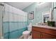 Cozy bathroom with shower, curtain, and vanity featuring granite countertops at 1103 Kudzu St, Durham, NC 27713