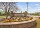 Attractive community sign with colorful flower beds, welcoming residents and visitors at 1103 Kudzu St, Durham, NC 27713