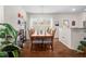 Well-lit dining room featuring a wooden table and seating for eight in a well-designed space at 1103 Kudzu St, Durham, NC 27713