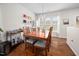 Bright dining room with a wooden table and a view of the backyard at 1103 Kudzu St, Durham, NC 27713