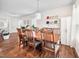 Spacious dining area featuring a wooden table set and hardwood flooring at 1103 Kudzu St, Durham, NC 27713