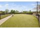 Well-maintained dog park with lush turf, benches, and secure fencing for pets at 1103 Kudzu St, Durham, NC 27713