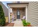Inviting front porch with seating and brick accents, creating a welcoming entrance at 1103 Kudzu St, Durham, NC 27713