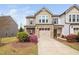 Attractive townhouse with a well-manicured front yard, two-car garage, and inviting entrance at 1103 Kudzu St, Durham, NC 27713
