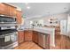 Modern kitchen with granite countertops and open layout to the dining area at 1103 Kudzu St, Durham, NC 27713