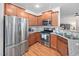 Well-equipped kitchen with stainless steel appliances and ample cabinet space at 1103 Kudzu St, Durham, NC 27713