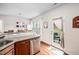 Open kitchen design with a view to the backyard and stainless steel dishwasher at 1103 Kudzu St, Durham, NC 27713