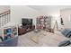 Cozy living room features stylish furniture and ample shelving for books and decor at 1103 Kudzu St, Durham, NC 27713