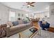 Open-concept living room leading into the dining area with hardwood floors at 1103 Kudzu St, Durham, NC 27713
