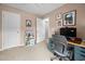 Functional office space with computer, desk, and ample storage for an efficient workspace at 1103 Kudzu St, Durham, NC 27713