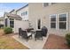 Outdoor patio area with comfortable seating and barbecue, perfect for relaxation and entertaining at 1103 Kudzu St, Durham, NC 27713