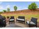 Outdoor patio area with stylish seating, grill, and a view of the well-maintained backyard at 1103 Kudzu St, Durham, NC 27713