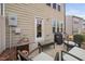 Cozy patio with seating, grill, and access to the home, perfect for outdoor relaxation at 1103 Kudzu St, Durham, NC 27713
