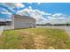 Large backyard featuring a well-maintained lawn and a white privacy fence, perfect for outdoor activities at 1110 Bent Willow Dr, Durham, NC 27704