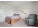 Bedroom featuring a reading chair, a bed, and built-in bookcases at 1110 Bent Willow Dr, Durham, NC 27704